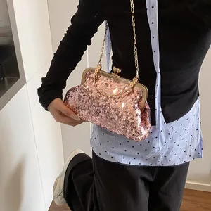 Sparkly pink sequin evening clutch bag with gold handle and chain strap for women