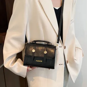 Classic black PU leather crossbody bag with top handle and gold button decoration