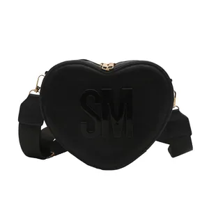 Fashionable black heart-shaped crossbody bag with gold zipper and wide strap
