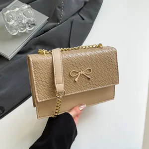Elegant khaki snake-pattern handbag with golden bow clasp and chain shoulder strap