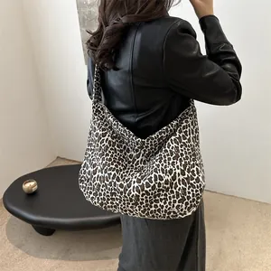 Stylish leopard print canvas tote bag with a slouchy hobo silhouette for women