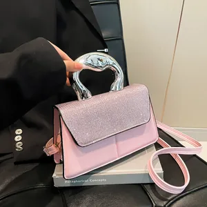 Pink rhinestone square handbag with sculptural silver metal handle and shoulder strap