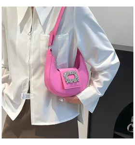 Detail of hot pink crescent bag with shiny silver square rhinestone buckle for women
