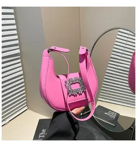 Pink crescent shoulder bag with elegant square rhinestone buckle and slender handle