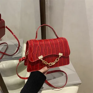 Red crocodile pattern box handbag with gold chain detail and detachable strap