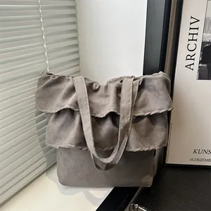 Gray suede tote bag with tiered ruffle design for women, stylish ballet-inspired handbag