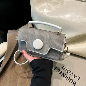 Retro grey and white contrast handbag with gold hardware and removable shoulder strap