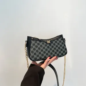 Minimalist black square shoulder bag with grey M letter pattern and gold logo