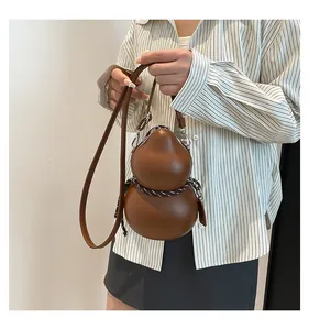 Detail of creative gourd-shaped crossbody bag in brown leather with woven rope detail