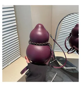 Detail of a dark purple gourd-shaped crossbody bag with woven cord and leather texture