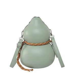 Unique pale green gourd-shaped crossbody bag with decorative woven cord and silver hardware