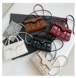 Collection of square textured shoulder bags in brown, burgundy, white, black, and beige