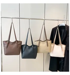 Detail showing high-capacity PU leather tote bags in four classic commute colors