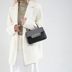 Chic two-tone black and grey small square crossbody bag with unique gold metal buckle design