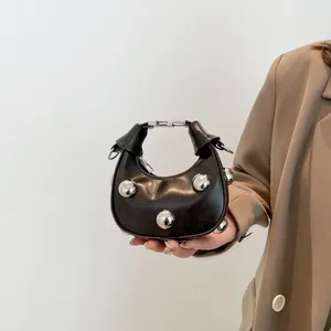 Mini semi-circle leather handbag with silver studs and metal handle for women