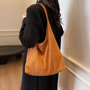 Minimalist caramel suede large capacity hobo bag showing stylish semi-moon silhouette