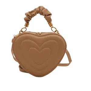Brown heart-shaped crossbody bag with tiered embossed layers and ruched handle
