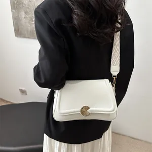 French style white leather shoulder bag with chic wide geometric patterned strap