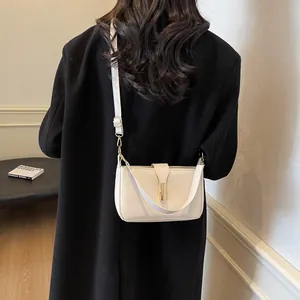 Chic white rectangular underarm bag with gold metal buckle and dual straps