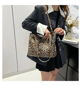 Leopard print tote bag styled with a minimalist blazer for daily commuting look
