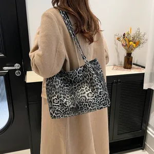 Retro leopard print tote bag with large capacity worn on shoulder with a stylish coat