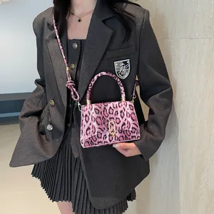 Pink leopard print square crossbody bag with gold buckle and stylish top handle