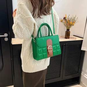 Chic green quilted shoulder bag for women with contrast leather strap and horseshoe buckle