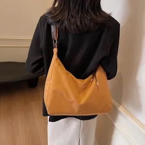 Vintage large canvas tote bag in ginger yellow with brown leather straps and white stitching