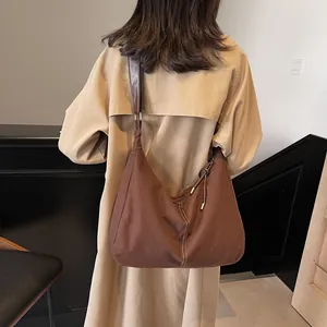 Vintage large capacity dark brown canvas tote bag with contrast stitching and leather strap