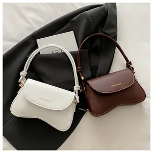 Detail of premium PU leather shoulder bags with gold Fashion & Bags lettering on flap