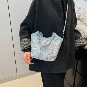 Elegant Chinese style light blue silk embroidery bucket bag with leather handles and strap