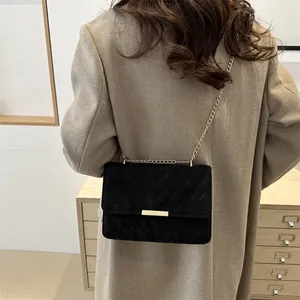 Elegant black quilted suede chain bag with golden clasp and vintage French style