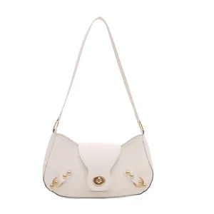 Minimalist creamy white half-moon underarm bag with golden hardware and metal clasp