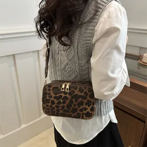 Stylish leopard print crossbody bag for women with dual zippers and adjustable strap