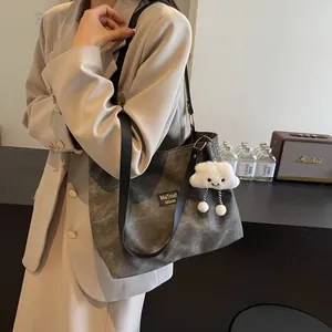 Vintage dark gray canvas tote bag with black leather straps and cute cloud plush pendant