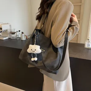 Large dark grey matte tote bag for women with plush cloud charm and black straps
