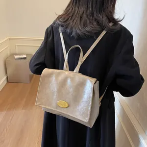 Minimalist vintage college style large faux leather backpack in taupe brown for women