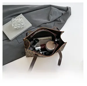 Interior view of leopard print tote bag showing spacious capacity for daily cosmetics