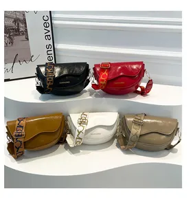 Detailed shot of retro saddle bags in five colors with stylish patterned shoulder straps