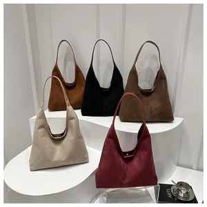 Group shot of large hobo tote bags in five matte faux suede colors with metal magnetic clasp