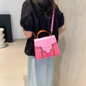 Pink crocodile texture leather handbag for women, casual crossbody style with gold hardware
