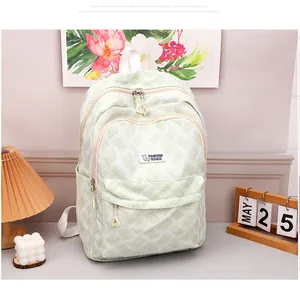 Close-up of lightweight green patterned backpack with durable fabric and storage pockets