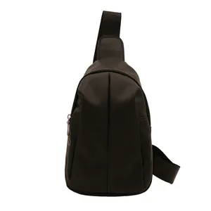 Minimalist black triangular crossbody chest bag in waterproof nylon fabric with metal zipper