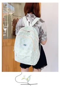 Close-up of lightweight green striped backpack featuring multiple zipper pockets and bunny label