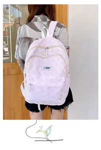Detailed view of pink and white textured backpack with Fashion Bags woven label