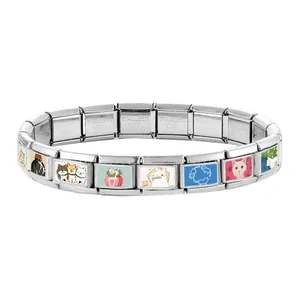 Macro view of modular stainless steel bracelet links with colorful pet and animal charms