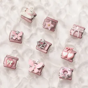Detail of DIY modular Italian charm links with pastel enamel shapes and tiny crystals