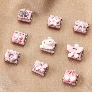 Detail of pink and silver Italian charms including crown, star and bow icons