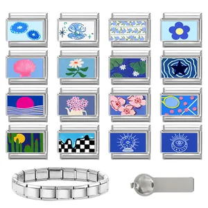 Detailed view of DIY modular stainless steel charm bracelet components with blue ocean themes
