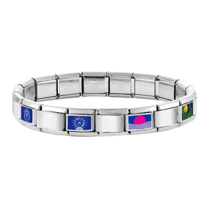 Macro detail of Italian modular charm bracelet with blue enamel evil eye and cactus charms